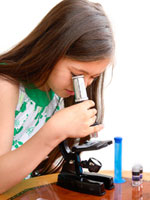 child at microscope